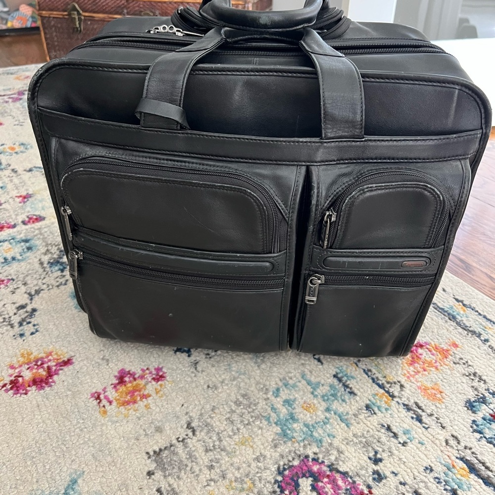 Tumi Black Briefcase with Durable Design and Spacious Compartments